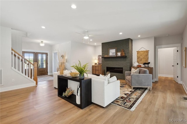 9463 Angels Share Dr, New Kent, VA 23124 - living room with stairs, baseboards, light wood-type flooring, recessed lighting, and ceiling fan