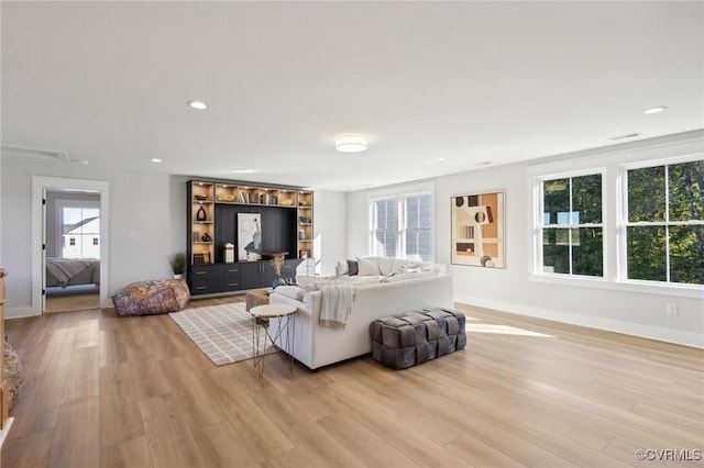 9463 Angels Share Dr, New Kent, VA 23124 - living room featuring healthy amount of natural light, light wood finished floors, baseboards, and recessed lighting