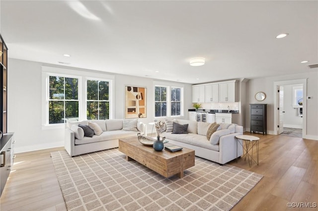 9463 Angels Share Dr, New Kent, VA 23124 - living area with light wood-style flooring, baseboards, and recessed lighting