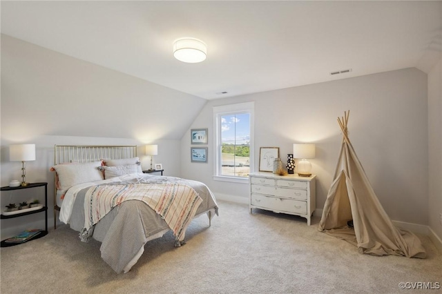 9463 Angels Share Dr, New Kent, VA 23124 - bedroom featuring lofted ceiling, light colored carpet, and baseboards