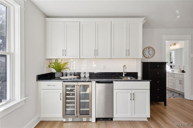 9463 Angels Share Dr, New Kent, VA 23124 - indoor wet bar with wine cooler, backsplash, and light wood finished floors