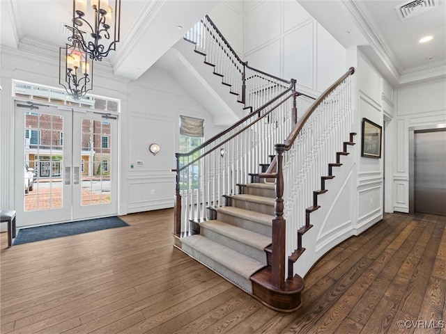 5241 Monument Ave Unit 2A, Henrico, VA 23226 - foyer with a decorative wall, a high ceiling, elevator, a chandelier, and stairs