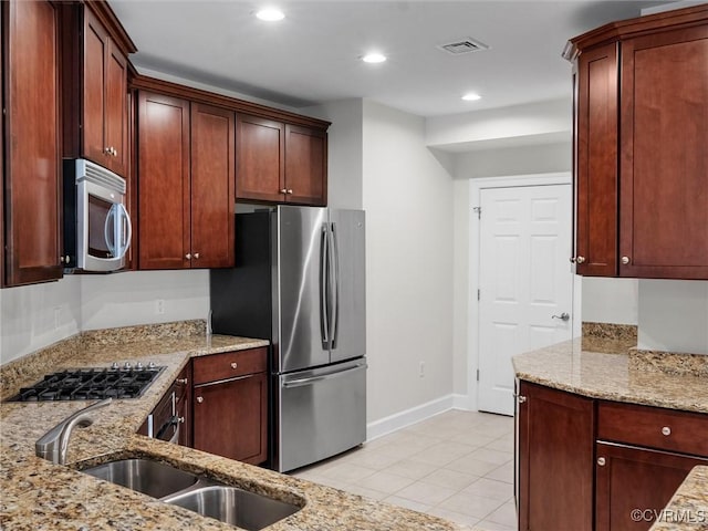 5241 Monument Ave Unit 2A, Henrico, VA 23226 - kitchen featuring appliances with stainless steel finishes, light tile patterned floors, light stone counters, and recessed lighting