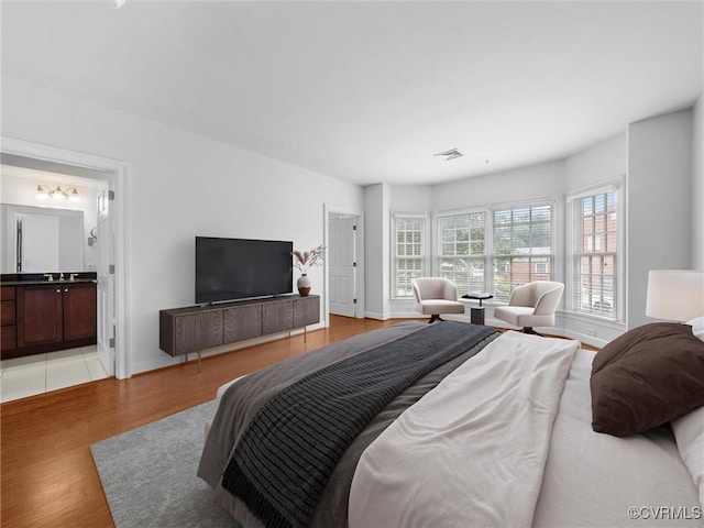 5241 Monument Ave Unit 2A, Henrico, VA 23226 - bedroom featuring light wood-style floors and ensuite bathroom