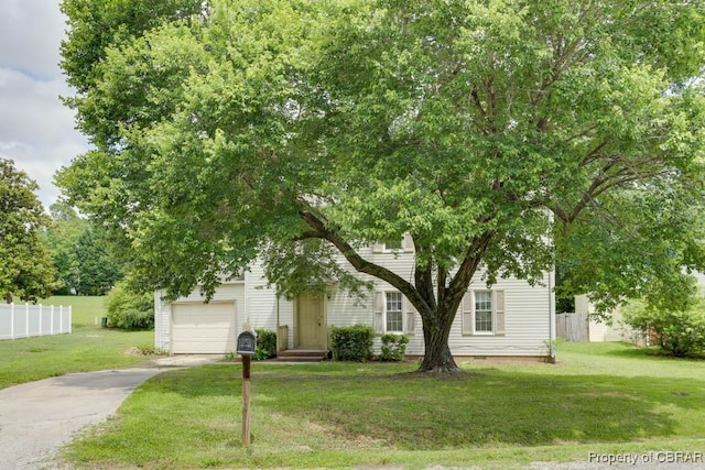 110 Astrid Ln, Williamsburg, VA 23188 - view of property hidden behind natural elements featuring concrete driveway and a garage