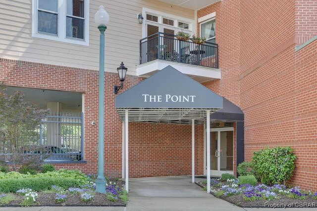 670 Town Center Dr Unit 418, Newport News, VA 23606 - doorway to property featuring brick siding