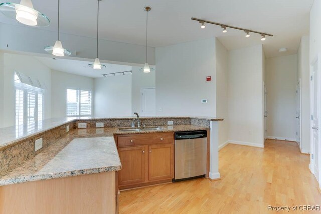 670 Town Center Dr Unit 418, Newport News, VA 23606 - kitchen with stainless steel dishwasher, track lighting, a sink, and light wood-type flooring