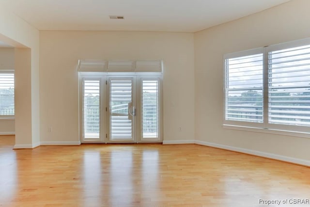 670 Town Center Dr Unit 418, Newport News, VA 23606 - empty room with light wood-style floors, plenty of natural light, and baseboards