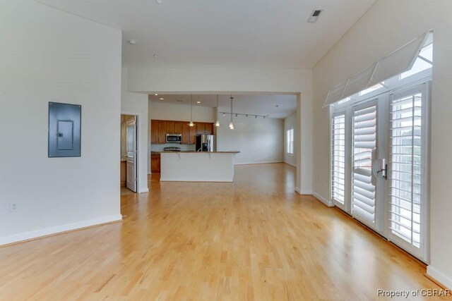 670 Town Center Dr Unit 418, Newport News, VA 23606 - unfurnished living room featuring electric panel, light wood-type flooring, and baseboards