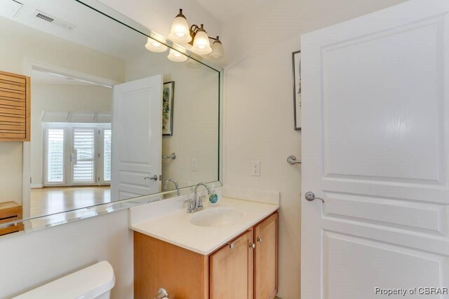 670 Town Center Dr Unit 418, Newport News, VA 23606 - bathroom featuring vanity and toilet
