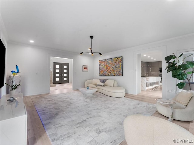11507 Barrington Bridge Ter, Henrico, VA 23233 - living room featuring ornamental molding, wood finished floors, a chandelier, french doors, and recessed lighting