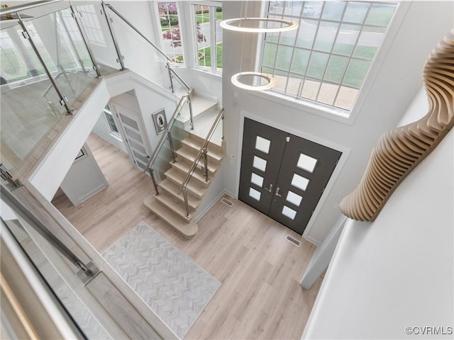 11507 Barrington Bridge Ter, Henrico, VA 23233 - foyer featuring wood finished floors, stairs, and a towering ceiling