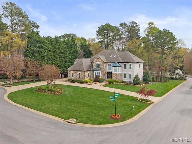 11507 Barrington Bridge Ter, Henrico, VA 23233 - view of front of property featuring stone siding, curved driveway, and a front lawn