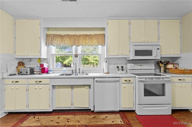 725 Transco Rd, Scottsville, VA 24590 - kitchen featuring white appliances, a sink, light countertops, dark wood-style floors, and backsplash