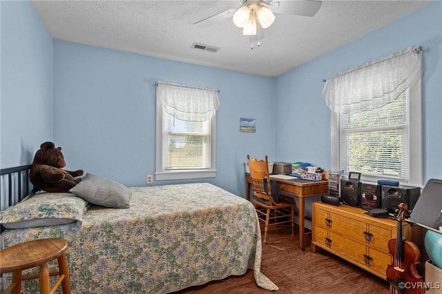 725 Transco Rd, Scottsville, VA 24590 - bedroom with multiple windows, wood finished floors, a desk, and ceiling fan