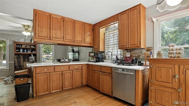 3913 Terjo Ln, Chester, VA 23831 - kitchen with dishwasher, light countertops, light wood-style floors, ceiling fan, and a peninsula