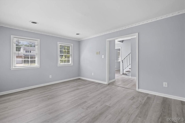 807 N Ave, Hopewell, VA 23860 - empty room with wood finished floors, baseboards, stairway, and crown molding
