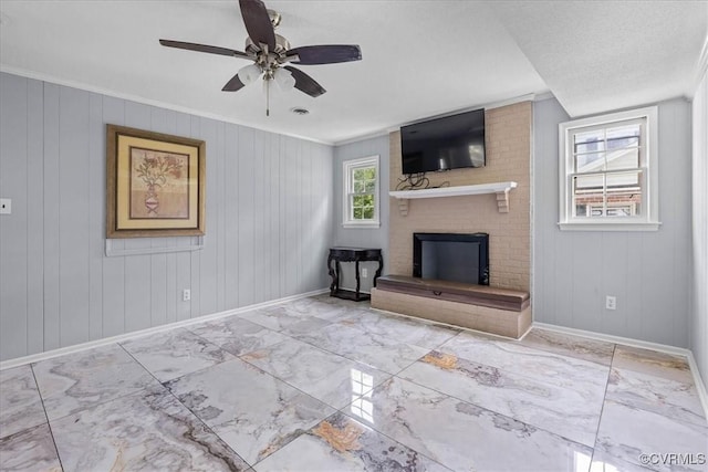 807 N Ave, Hopewell, VA 23860 - unfurnished living room featuring baseboards, a fireplace, marble finish flooring, a ceiling fan, and crown molding
