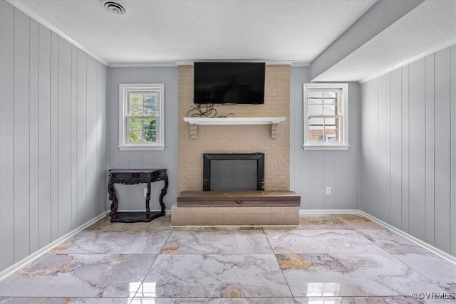 807 N Ave, Hopewell, VA 23860 - unfurnished living room featuring a fireplace, ornamental molding, baseboards, wood walls, and marble finish floors