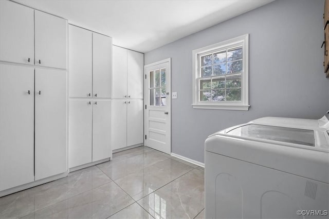 807 N Ave, Hopewell, VA 23860 - washroom featuring cabinet space, baseboards, and light marble finish flooring