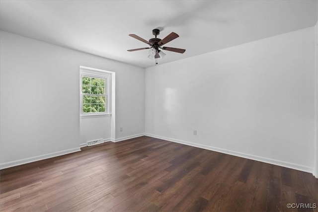 807 N Ave, Hopewell, VA 23860 - unfurnished room featuring dark wood finished floors, ceiling fan, and baseboards
