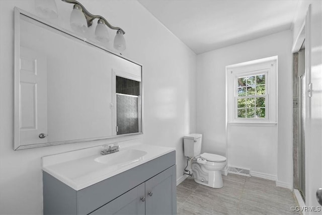 807 N Ave, Hopewell, VA 23860 - full bathroom featuring baseboards, vanity, toilet, and a shower with shower door