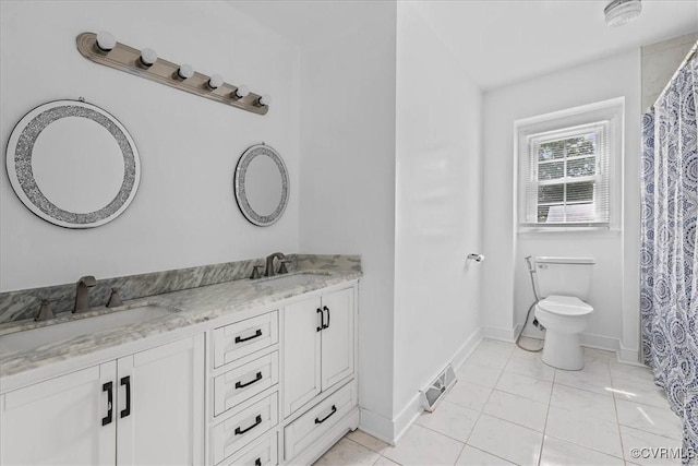 807 N Ave, Hopewell, VA 23860 - bathroom with double vanity, toilet, and baseboards