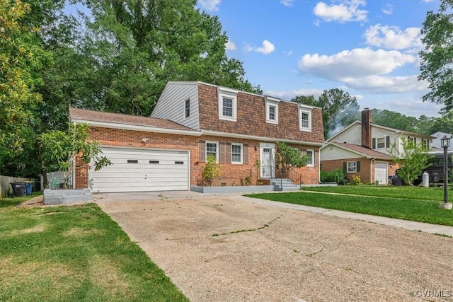 807 N Ave, Hopewell, VA 23860 - view of front facade with brick siding, driveway, an attached garage, a front yard, and a gambrel roof