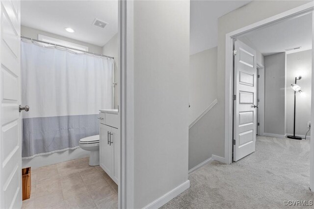 3821 Meridian Ave, Richmond, VA 23234 - full bathroom with toilet, baseboards, and vanity