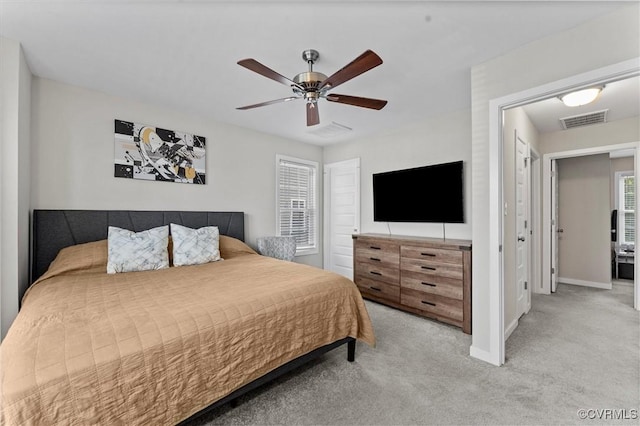 3821 Meridian Ave, Richmond, VA 23234 - bedroom featuring light carpet, baseboards, and a ceiling fan