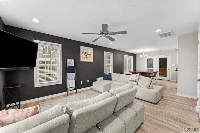 3821 Meridian Ave, Richmond, VA 23234 - living room with a chandelier, plenty of natural light, baseboards, light wood-style flooring, and recessed lighting