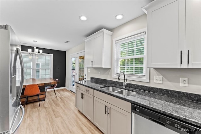 3821 Meridian Ave, Richmond, VA 23234 - kitchen featuring stainless steel appliances, a sink, light wood-style floors, plenty of natural light, and recessed lighting