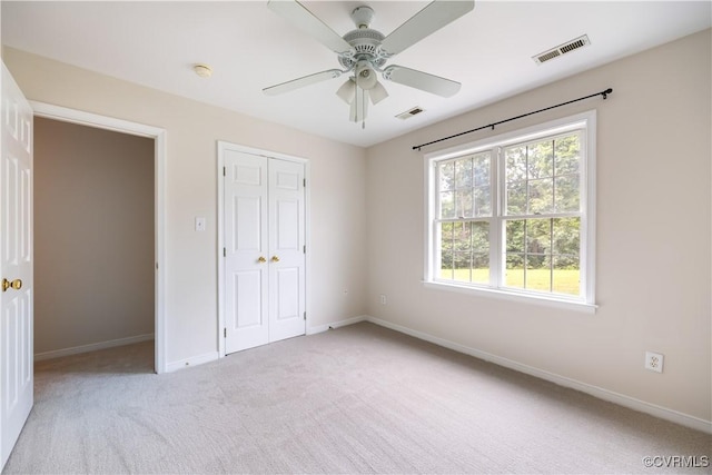 14000 Shady Pointe Ct, Midlothian, VA 23112 - unfurnished bedroom with baseboards, light carpet, a closet, and ceiling fan
