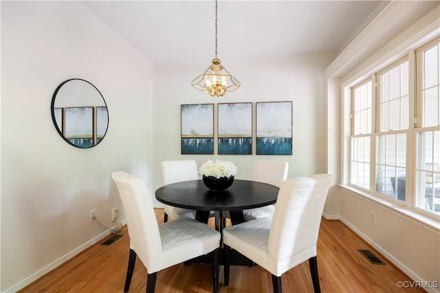 14000 Shady Pointe Ct, Midlothian, VA 23112 - dining room featuring baseboards, light wood finished floors, and a chandelier