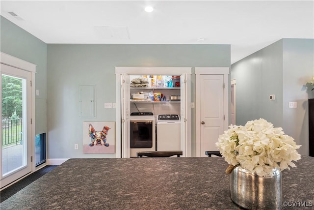 9300 Adkins Rd, Charles City, VA 23030 - kitchen with independent washer and dryer, dark stone counters, and baseboards