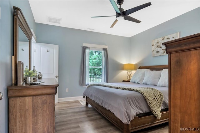 9300 Adkins Rd, Charles City, VA 23030 - bedroom with wood finished floors, baseboards, and a ceiling fan