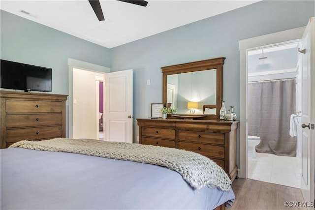 9300 Adkins Rd, Charles City, VA 23030 - bedroom featuring wood finished floors, connected bathroom, and a ceiling fan