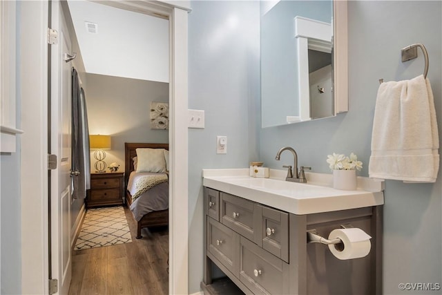 9300 Adkins Rd, Charles City, VA 23030 - ensuite bathroom featuring vanity and wood finished floors