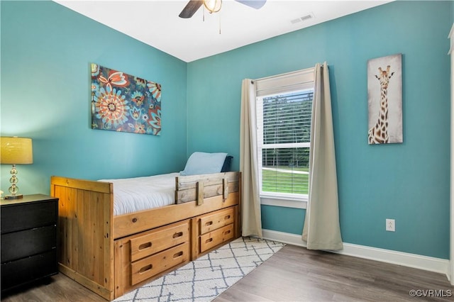 9300 Adkins Rd, Charles City, VA 23030 - bedroom featuring multiple windows, wood finished floors, baseboards, and a ceiling fan
