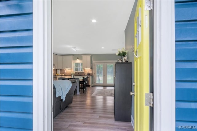 9300 Adkins Rd, Charles City, VA 23030 - hallway featuring french doors, wood finished floors, and recessed lighting