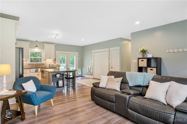 9300 Adkins Rd, Charles City, VA 23030 - living room featuring light wood-type flooring, french doors, recessed lighting, and baseboards