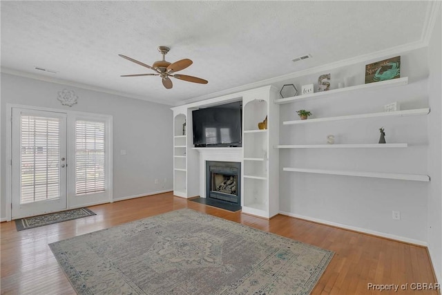 2024 Sarahs Cove Dr, Gloucester, VA 23072 - unfurnished living room with ceiling fan, ornamental molding, a fireplace with flush hearth, a textured ceiling, and wood finished floors