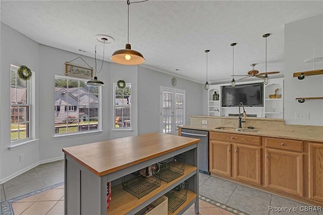 2024 Sarahs Cove Dr, Gloucester, VA 23072 - kitchen featuring stainless steel dishwasher, light tile patterned floors, healthy amount of natural light, a textured ceiling, and crown molding