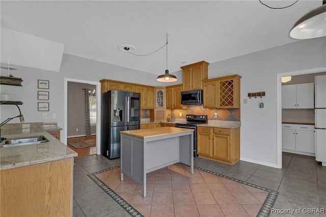 2024 Sarahs Cove Dr, Gloucester, VA 23072 - kitchen with refrigerator with ice dispenser, stainless steel microwave, electric range oven, light tile patterned floors, and decorative backsplash