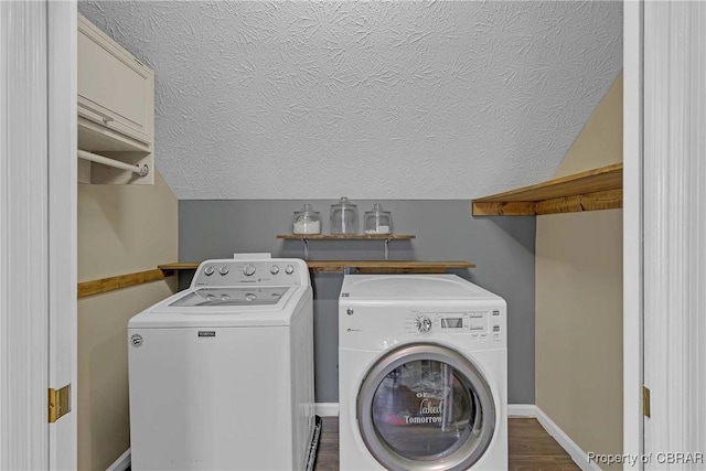 2024 Sarahs Cove Dr, Gloucester, VA 23072 - washroom featuring washing machine and clothes dryer, a textured ceiling, and wood finished floors