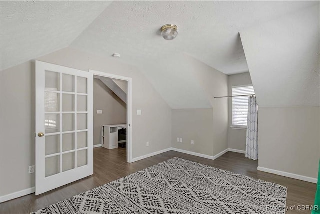 2024 Sarahs Cove Dr, Gloucester, VA 23072 - additional living space featuring lofted ceiling, wood finished floors, and a textured ceiling