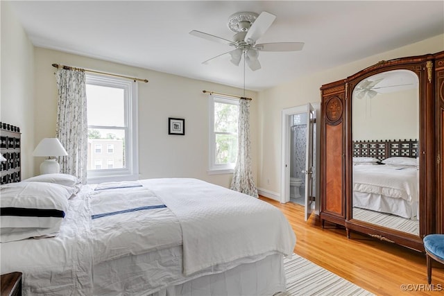 3029 Monument Ave Unit U6, Richmond, VA 23221 - bedroom with light wood-style flooring, ceiling fan, connected bathroom, and baseboards