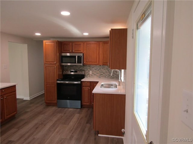 135 Trudie Dr, Center Cross, VA 22437 - kitchen featuring stainless steel appliances, light countertops, dark wood-type flooring, tasteful backsplash, and recessed lighting