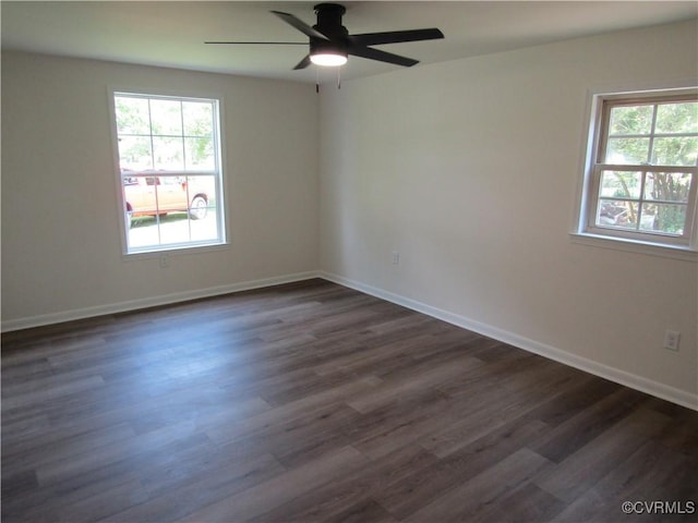 135 Trudie Dr, Center Cross, VA 22437 - spare room featuring healthy amount of natural light, dark wood-style floors, and ceiling fan