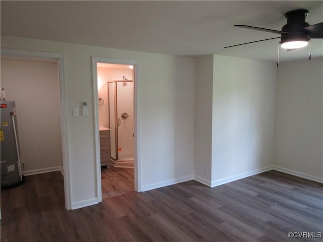 135 Trudie Dr, Center Cross, VA 22437 - empty room featuring a ceiling fan, wood finished floors, and water heater
